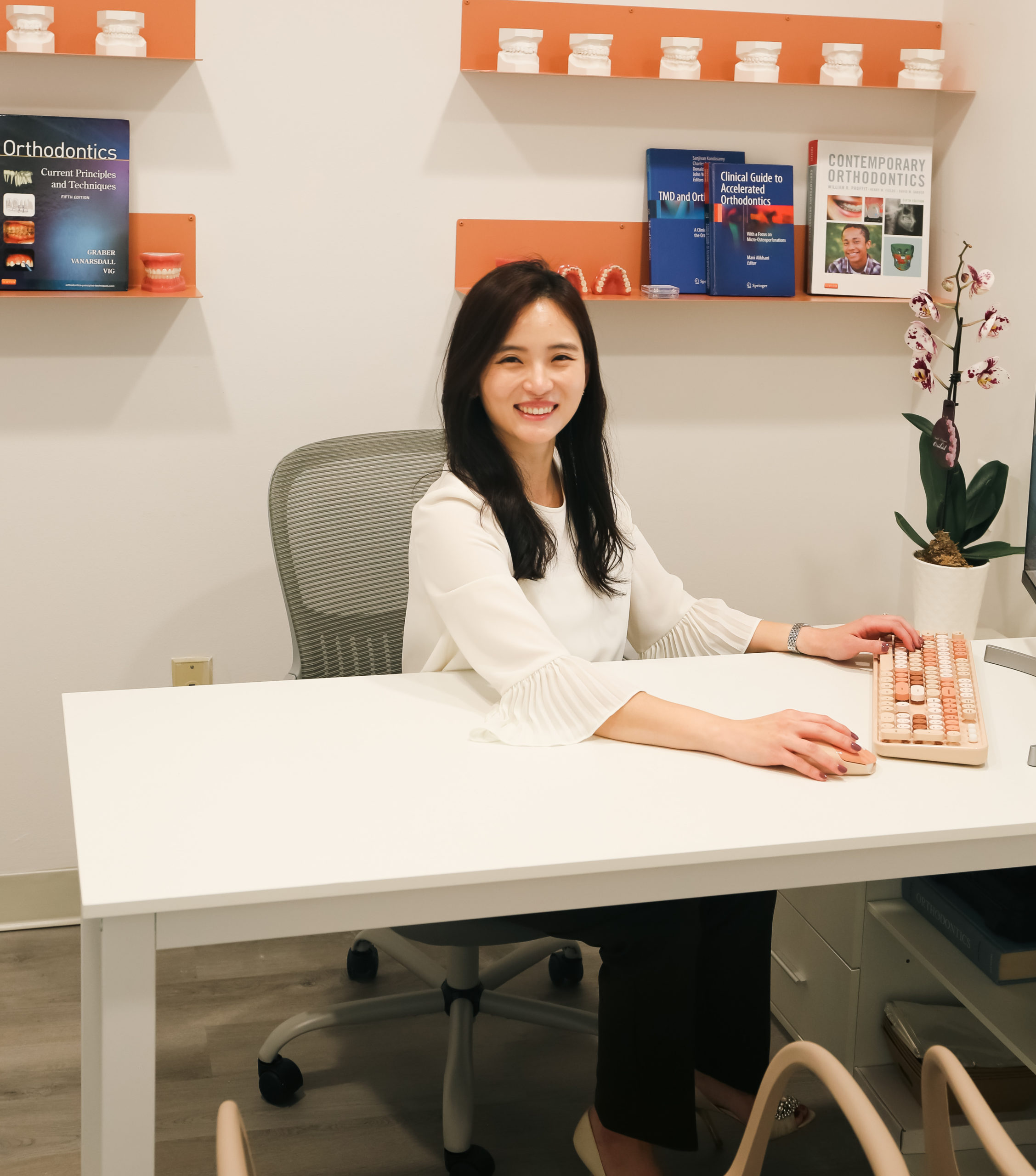 Dr. Yubin working at her desk